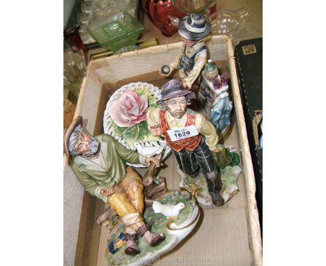 Three Capo-di-Monte pieces: a man with doves, a tramp and another playing boules with woven basket