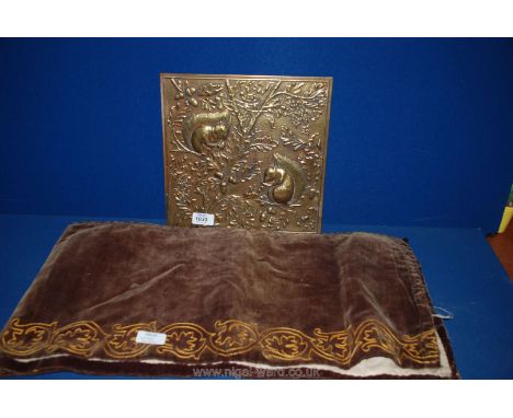 A Victorian embroidered mantelpiece runner 240cm (8') long, and an old square brass plaque depicting two squirrels in an oak 