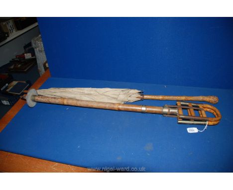 A vintage bamboo shooting Stick and a bamboo and silk Parasol (as found)