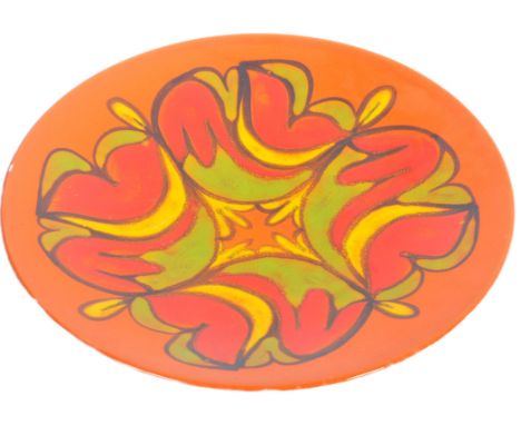 Poole Pottery - Delphis Range - A retro mid 20th Century charger plate having glazed decorations. Signed JM and dated 1975 to