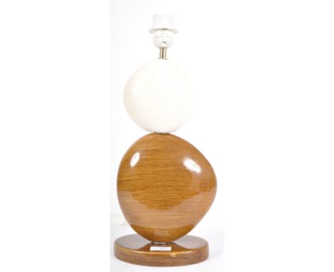 A contemporary designer ceramic pebble table lamp light in two tones with all raised on an oval ceramic base. Sold as unteste