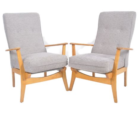 Remploy - A matching pair of mid 20th Century beech framed armchairs / lounge chairs with each having tall padded backrest wi