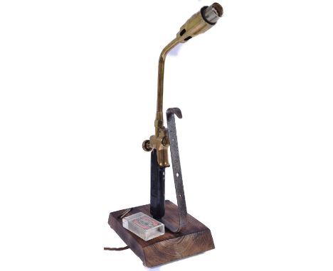 A retro vintage 20th Century steampunk industrial desk lamp converted from a blowtorch. Mounted on stand set with fixed match