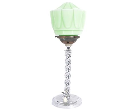A vintage early 20th Century Art Deco table / desk lamp light having a shaped mint green glass shade supported by a twisted c