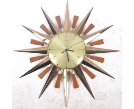 Timescope - A retro 20th Century&nbsp;sunburst / starburst wall clock. Central circular dial with faceted hands and Roman Num
