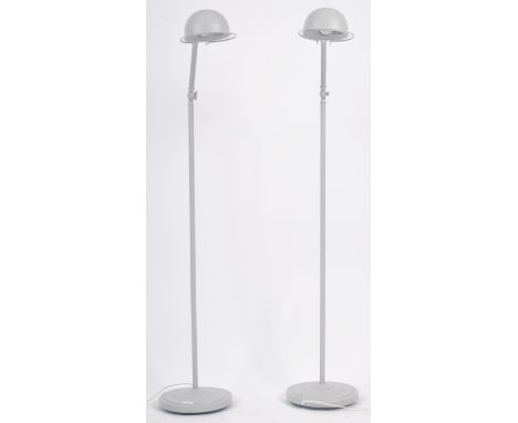 A matching pair of Contemporary metal grey finished Anglepoise floor standing lamp lights with each having domed shades raise