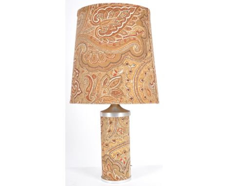 A retro 20th Century 1970s Paisley design table lamp light having a barrel shade and cylindrical lamp base. Sold as untested.