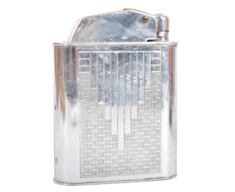 Floating Lighter - An early 20th Century French Art Deco chromed brass lighter having engine turned decoration to the case. M