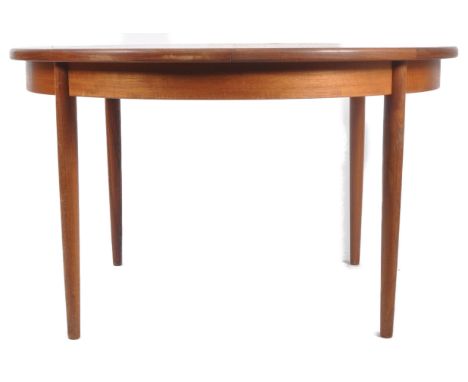 G Plan - British Modern Design - A retro vintage mid 20th Century circa 1960s extendable dining table. The table of circular 