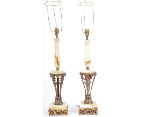 A matching pair of 20th Century Italian influence Hollywood Regency brass and alabaster table lamp lights with open section c