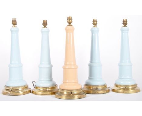 A set of five 20th Century lighthouse style coloured glass table lamp lights. Four lamps finished in light blue and another i