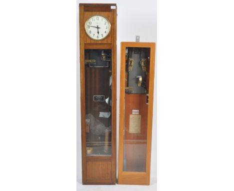 Magneta - A retro vintage mid 20th Century&nbsp;electric master dual cased wall clock having a circular dial with Arabic nume