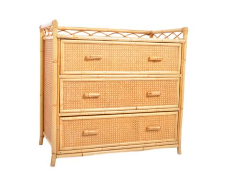 A retro vintage mid 20th Century 1970s bamboo &amp; rattan chest of drawers. The chest having a gallery surround with a bank 