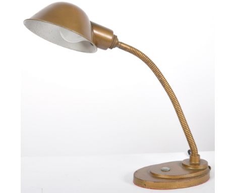 A vintage 20th Century Art Deco table / desk top lamp light having a brass effect finish with cup shade upon a gooseneck adju