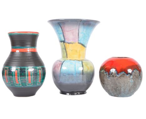 A mixed selection of three retro mid 20th Century West German pottery vases of various designs including a fat lava bulbous s