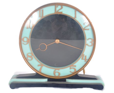 Smiths - A vintage 20th Century Art Deco bakelite mantel clock having a circular dial in blue and black with brass Arabic num