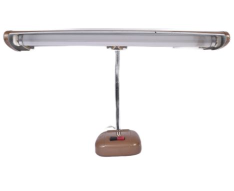 A retro vintage 20th Century work table desk lamp light having an elongated brown shade with adjustable arm over base.&nbsp;S