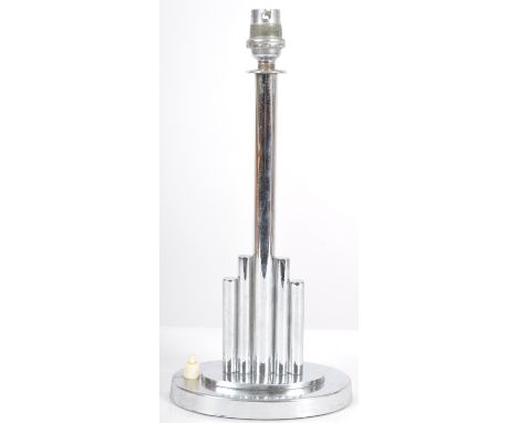 A vintage 20th Century Art Deco chrome table lamp light having a central cylindrical stem flanked by two graduating supports 