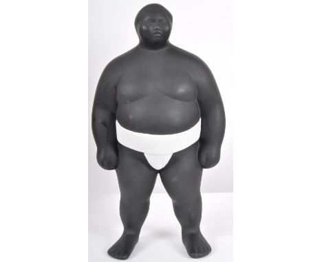 A contemporary ceramic sculpture / figure in the form of a Sumo Wrestler finished in matte black and white&nbsp;mawashi. Unsi