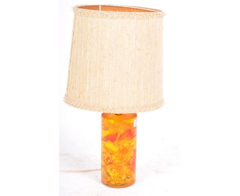 A retro vintage mid 20th Century Shatterline amber type resin table lamp light. The base of cylindrical form with hints of re