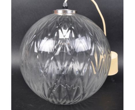 A retro vintage mid 20th Century Danish glass ball lamp ceiling light of globe form. Clear glass with chevron / diamond decor