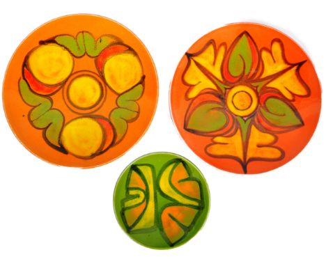Poole Pottery - Delphis Range - A selection of three retro mid 20th Century ceramic plates each with glazed decorations and m