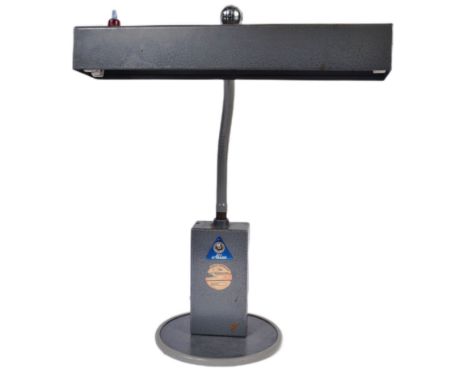 A retro vintage industrial work lamp by Allen &amp; Co. Long lamp light top with square junction box raised on circular base.