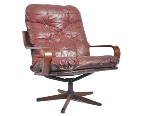 A retro mid 20th Century bentwood &amp; leather swivel lounge chair / easy armchair having a bentwood frame with patchwork bu