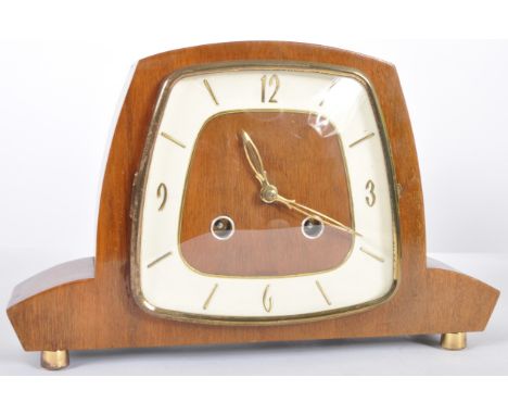 A retro vintage 20th Century Art Deco walnut cased mantel clock having a white painted chapter ring with baton and Arabic num