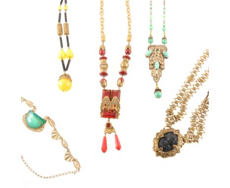 A red stone and gilt metal sautoir, dark red stones with gilt metal decoration and chain links, terminating in a dark and pal