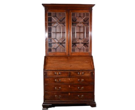 George III mahogany bureau with a matched bookcase top, upper section with a moulded cornice, fitted pane glazed doors, burea