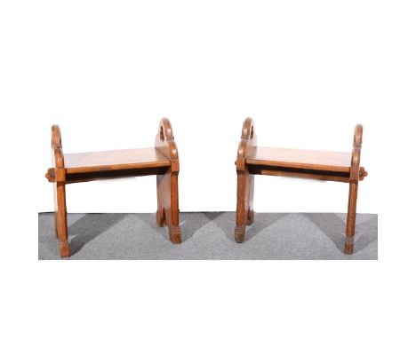 A pair of Victorian Gothic bench stools, of pegged construction, fretted trefoils, width 65cm, depth 34cm, height 59cm.