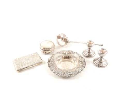 An Edwardian silver cased purse by Walker &amp; Hall, Birmingham 1902, calfskin fitments, low relief panel to the front aspec