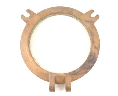 A cast brass ship's porthole cover, pane diameter 25cm, total width including hinge bracket 37cm.