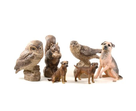 Three Poole Pottery stoneware animals, including squirrel, owl and falcon, signed Linley Adams; two Border Fine Arts Studio f