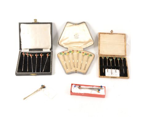 A set of six silver and enamel "cockerel" cocktail sticks by Walker &amp; Hall, Birmingham 1931-2, cased, a similar set of tw