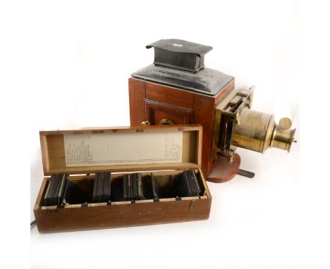 A mahogany and gilt metal magic lantern, and a large collection of lantern slides, many Boer War and First World War, as well