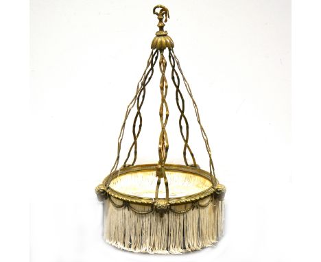 A cast brass ceiling light, with five cast rams heads to the suspension ring, with silk fringe, diameter 40cm, drop 60cm.
