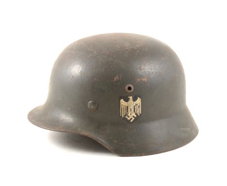 WWII German steel war helmet with side decals.
