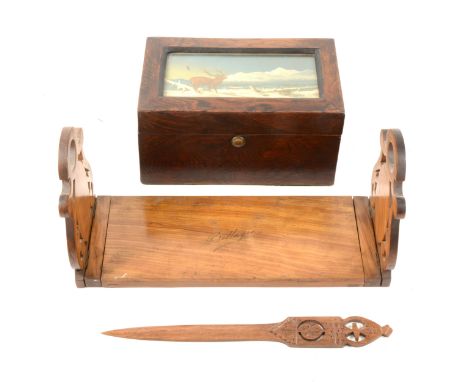 A Sorrento ware olive wood fold down sliding book rack with figural inlays, and named "Bellagia", 33cm extending to 53cm, an 