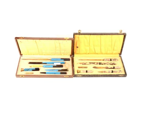 Two Art Deco Bakelite and gilt metal writing sets, a seven piece turquoise and black set comprising two letter openers, dip p