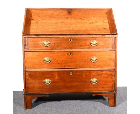 A Georgian stained mahogany bureau, fall-front enclosing a fitted interior with drawers and pigeon holes, three graduating lo