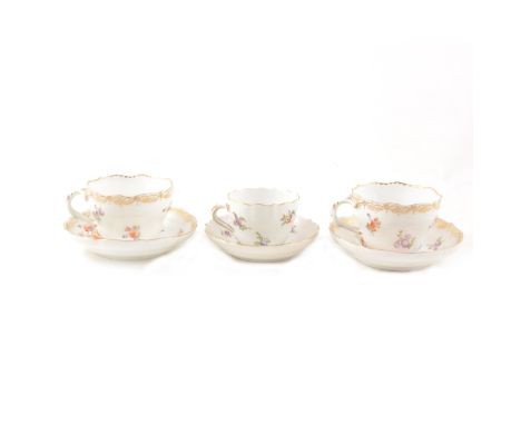 Meissen cabinet cup and saucer, second quality, floral decoration; and two Dresden cups and saucers, (6).