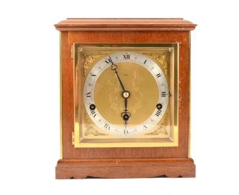 An English walnut mantel clock, moulded cornice, brass dial, moulded plinth, Elliott eight-day lever movement, striking on ei