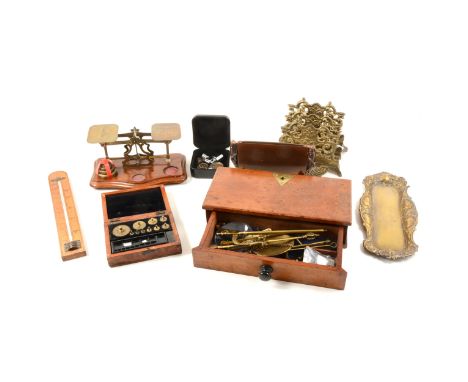 A set of brass postal scales and weights on a serpentine fronted mahogany base, 20cm, a mahogany drawer with a set of brass p
