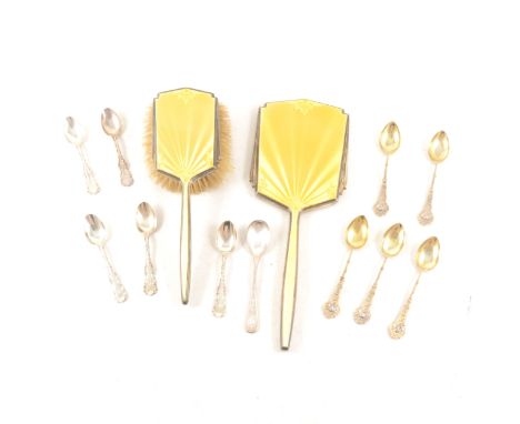 A silver and yellow enamel hand mirror and brush by Walker &amp; Hall, Sheffield 1948, six coffee spoons with gilt bowls and 