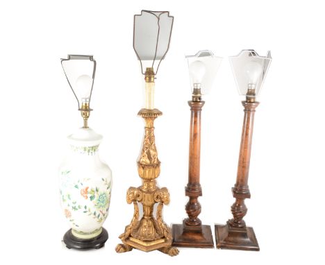 A pair of turned walnut table lamps, square bases, 52cm; a gilt lamp; a pair of plated table lamps; and a Chinese porcelain l