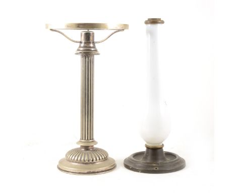 Hukin and Heath, a silver plated table candle lamp with reeded column, lacking shade. Height 32cms. together with a glass can