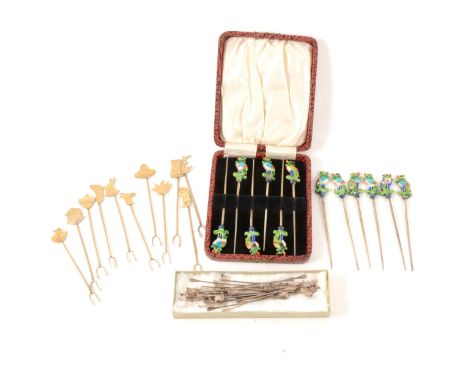 A cased set of six white metal and enamel cocktail sticks, peacock finials, marked "China", another six similar with no box; 