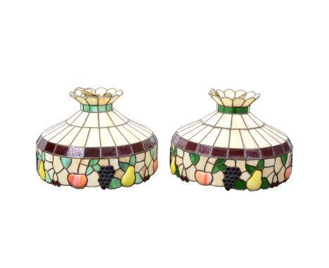A pair of large Tiffany-style light shades, leaded glass with a border of fruit and vines, diameter 61cm, height 38cm.